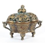 A Chinese bronze censer, perhaps with traces of gilding, of lobed form,