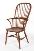 An elm and yew Windsor chair, late 19th/early 20th century, with high hoop spindle back,