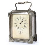 A French metal cased carriage clock, the cream dial with Roman hours above a subsidiary alarm dial,