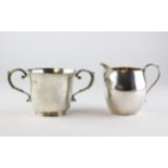 A silver cream jug, hallmarked London, together with a two handled sugar bowl, hallmarked Chester