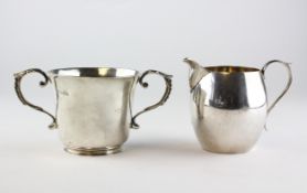 A silver cream jug, hallmarked London, together with a two handled sugar bowl, hallmarked Chester