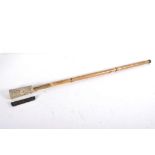 A malacca, brass and carved bone mounted walking stick/cane,