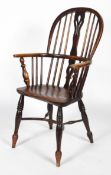 An ash and elm Windsor chair with crinoline stretcher, with pierced vase shaped splat,