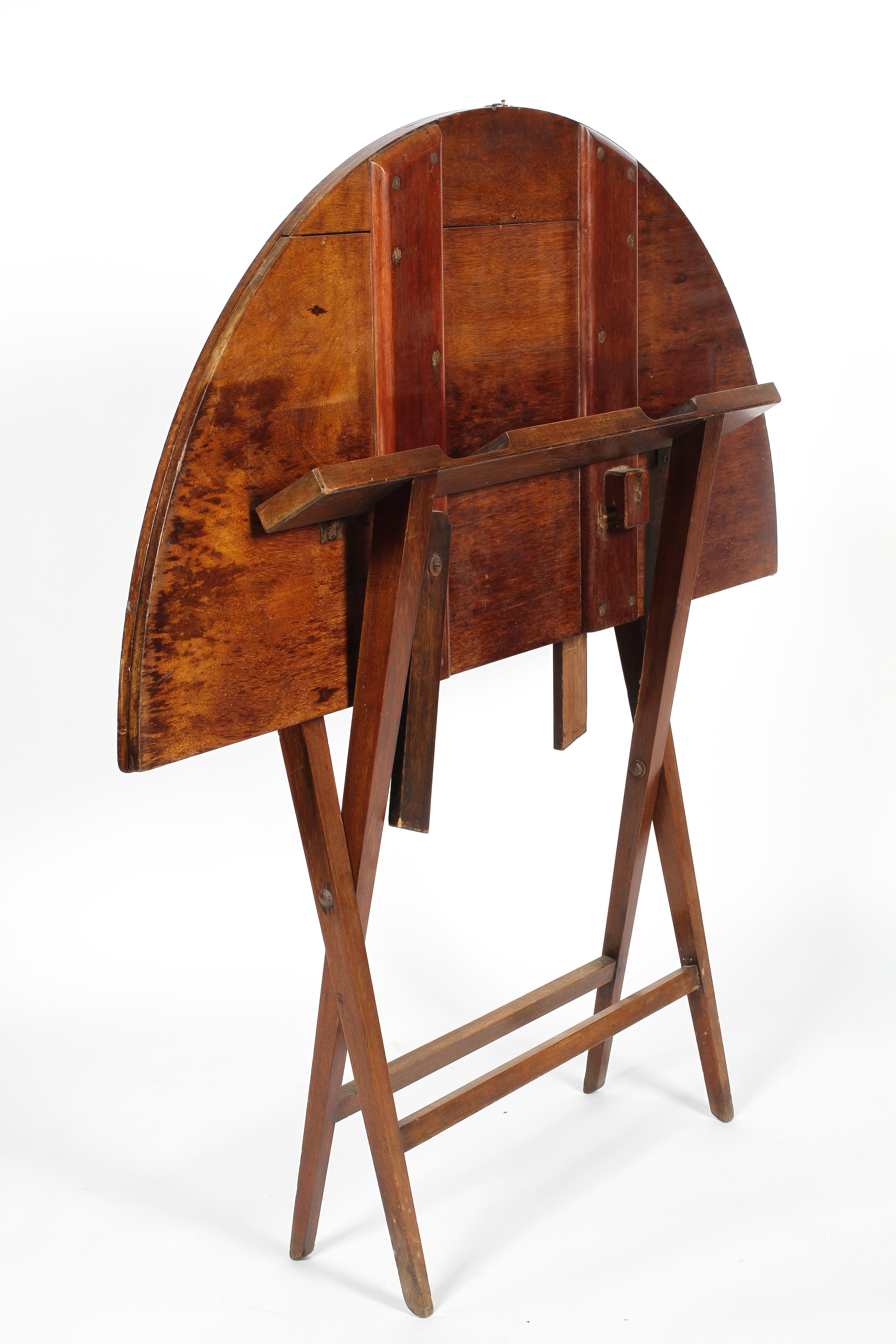 A Victorian mahogany coaching table, the circular top on a folding X frame, 60cm high, - Image 2 of 3