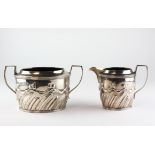 A Victorian silver twin handled sugar bowl with matching cream jug,