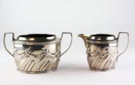 A Victorian silver twin handled sugar bowl with matching cream jug,
