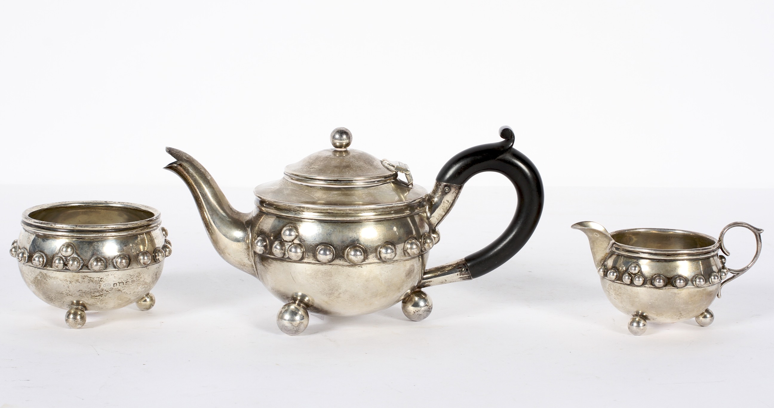 A silver batchelars three piece tea set, moulded on the Glastonbury bowl, of rounded form.