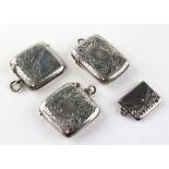Three silver vesta cases, each with engraved foliate motifs,