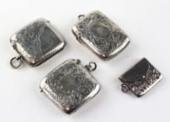 Three silver vesta cases, each with engraved foliate motifs,