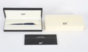A Mont Blanc ballpoint pen in blue and silver, fitted in black case with writing instructions,