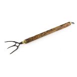 An antique brass-mounted extending telescopic three piece toasting fork,