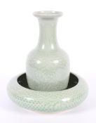 A Chinese celadon glazed vase, 20th century, of baluster form,