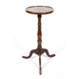 A George III mahogany tripod wine table, the circular top inlaid with octagonal marquetry,