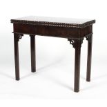 A mahogany card table, 19th century, in the Chippendale style, with pierced brackets,