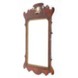 A George I walnut and parcel gilt fretwork mirror,