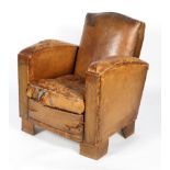 A vintage tan leather club chair in the Art Deco style, on block feet,