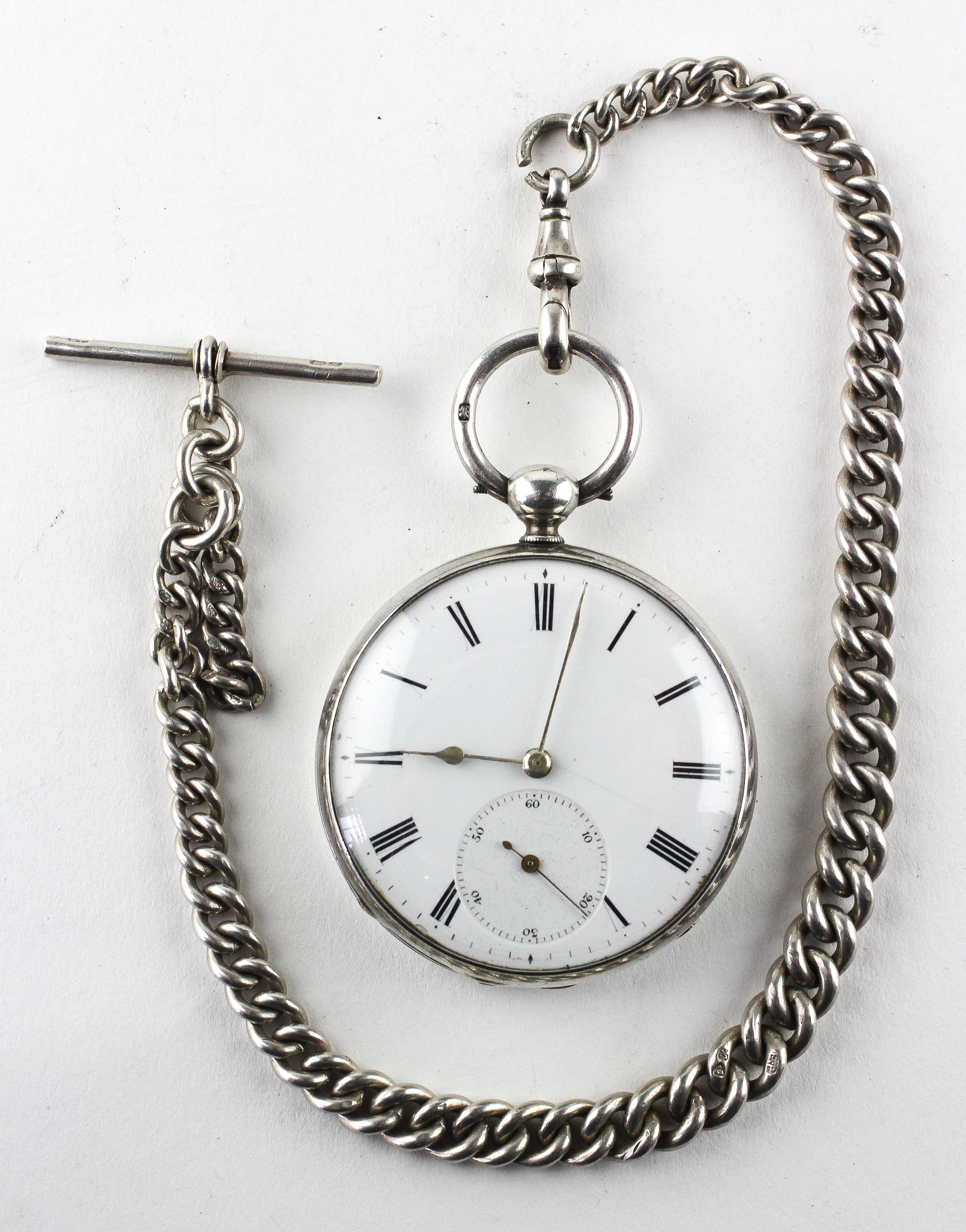 A large open face pocket watch. Circular white dial with roman numerals. Key wound movement.