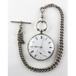 A large open face pocket watch. Circular white dial with roman numerals. Key wound movement.