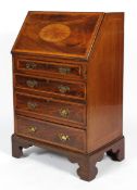 A Sheraton Revival mahogany and inlaid lady's bureau, the fall front enclosing a fitted interior,