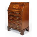 A Sheraton Revival mahogany and inlaid lady's bureau, the fall front enclosing a fitted interior,