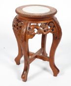 A Chinese hardwood and marble stand