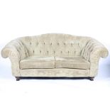 A contemporary chesterfield two-seater sofa by 'John Sankey', upholstered in beige chenille,