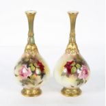 A pair of Royal Worcester blush ivory drop shaped vases, decorated with rose blooms,