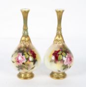A pair of Royal Worcester blush ivory drop shaped vases, decorated with rose blooms,