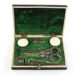 A Victorian papier mache sewing set case, containing a matched white metal sewing set,