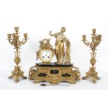 A French gilt metal mantel clock, the 3 1/2" enamelled dial on a brass,