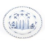 An English delftware blue and white charger, circa 1760, probably London or Bristol,