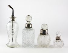 Two silver topped cut-glass sent bottles,