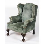 A George II style wing back armchair, 19th century,