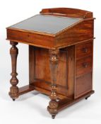 A Victorian mahogany davenport, with leather inset hinged top,