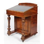 A Victorian mahogany davenport, with leather inset hinged top,