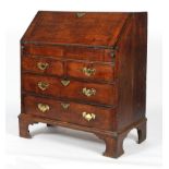 A George III oak bureau,