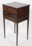 A late 19th/early 20th century mahogany bedside chest of drawers, comprising two short drawers,