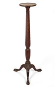 A George III style mahogany torchere stand, early 20th century,