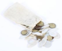 An extensive collection of 19th century Oriental mother of pearl games tokens,