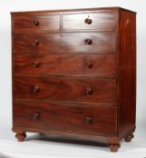 A Victorian mahogany chest of two short and four long drawers on bun feet,