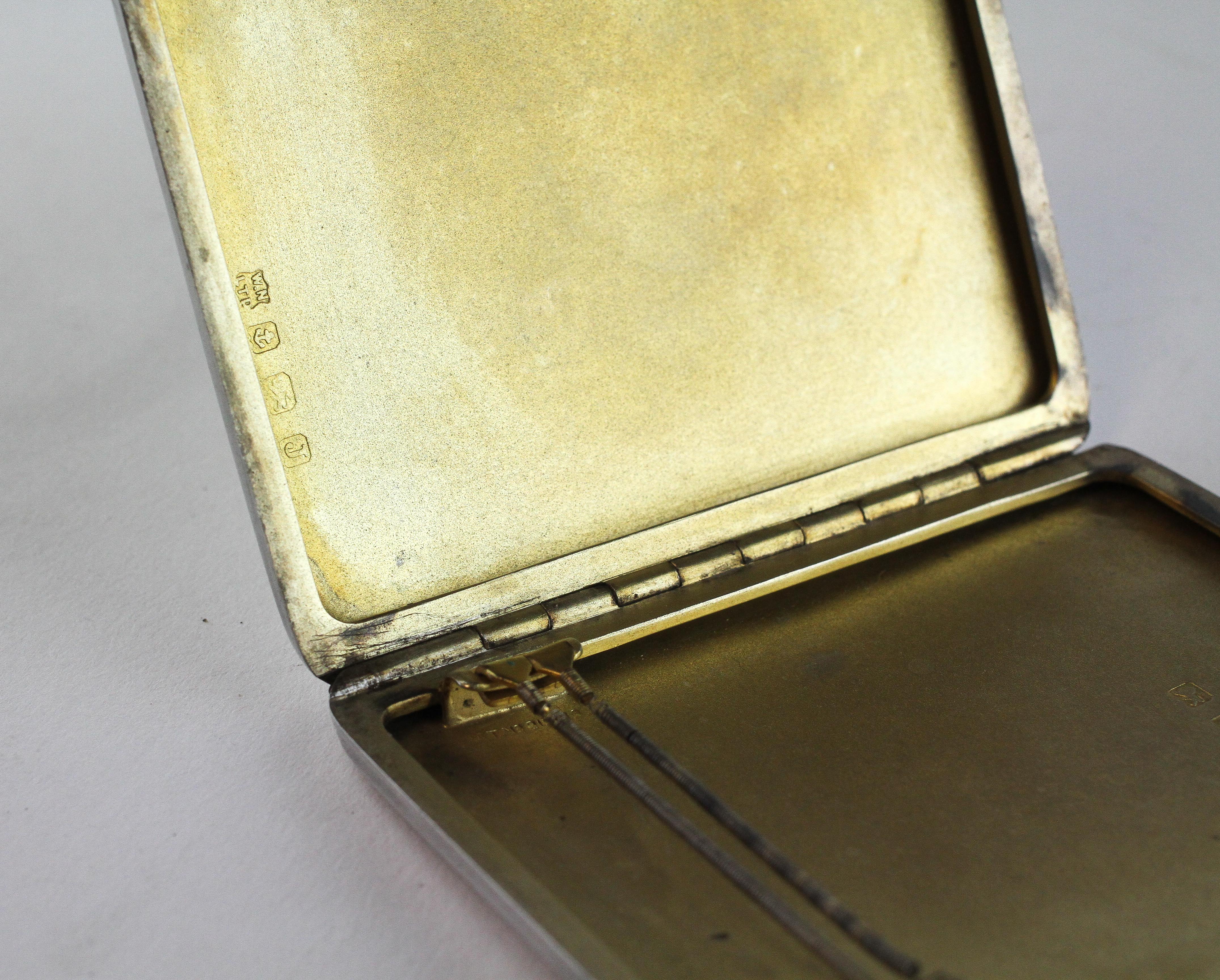 A silver cigarette case with engine turned decoration, hallmarked for Brimingham 1933, - Image 2 of 2