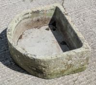 A horseshoe shaped trough, with aperture,