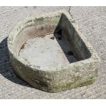 A horseshoe shaped trough, with aperture,