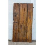 A planked elm door, possibly 17th century, with iron furniture,