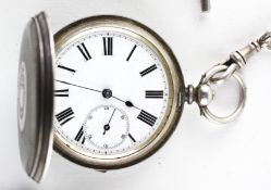 A full hunter pocket watch. Circular white dial with roman numerals.