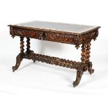 A Victorian carved oak desk, the top inset with tooled blue leather, with gadrooned, frieze,