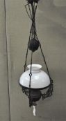 A Victorian hanging oil lamp, converted to electricity,