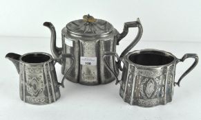 A late Victorian three piece Britannia metal tea set, comprising tea pot, sugar dish and milk jug,