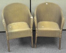 A pair of gold coloured LLoyd Loom chairs,