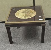 A coffee table with map of the World adorning the top, of square form,